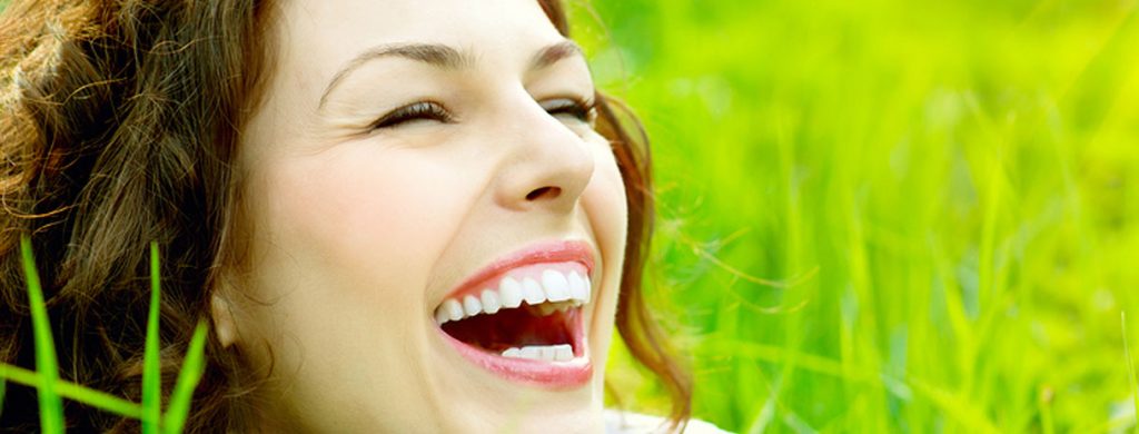 Stock image of a girl smiling with mouth open widely