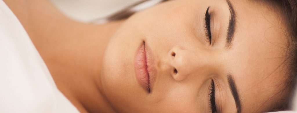 Stock image of a girl with eyes closed and sleeping