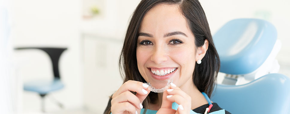 Smiling Model holds Teeth Clip Stock Image